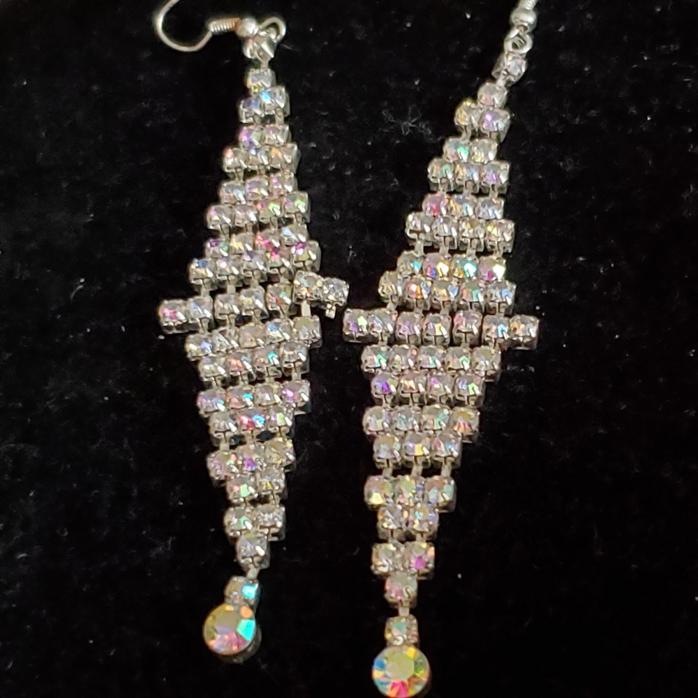 Silvertone diamond shaped dangle earrings with aurora borealis stones